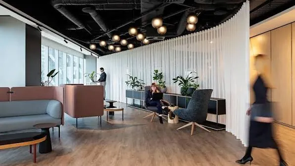 Consultant presenting to a small group in a meeting room